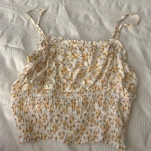 Sunflower print, cropped, spaghetti strapped blouse.